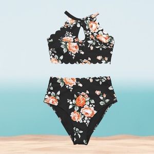 Woman’s halter top bikini in black, peachy/ orange floral